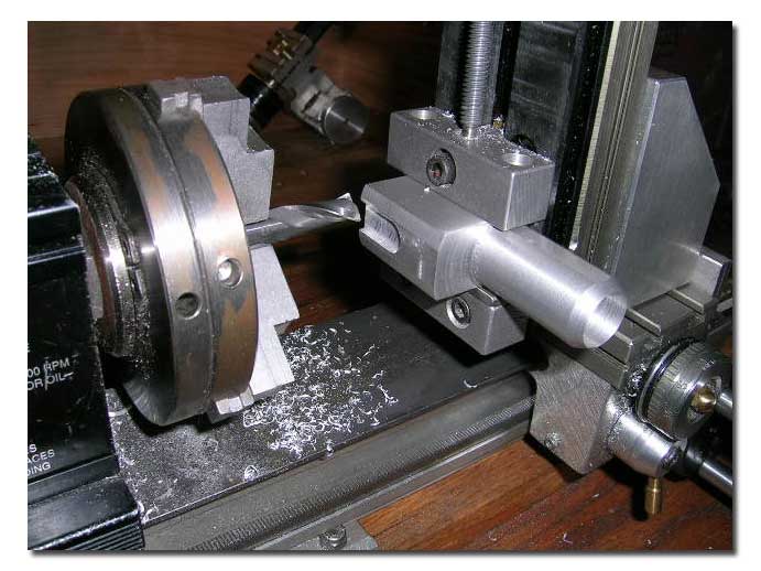 Milling the slot for the adjustment linkage. Milling the slot for the adjustment linkage.